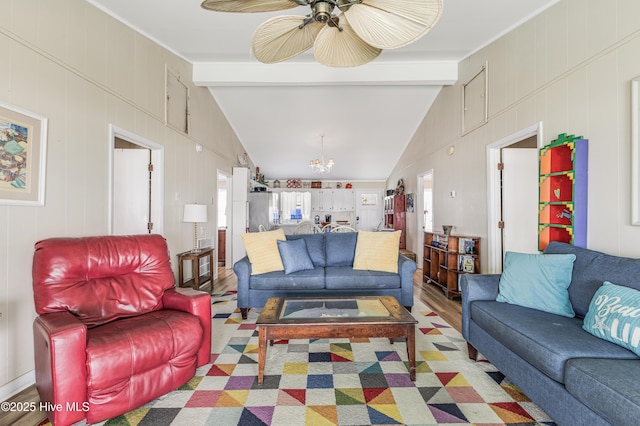 3325 W Beach Dr, Oak Island, NC 28465 - living area featuring a chandelier, light wood finished floors, and ceiling fan