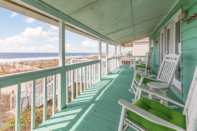 3325 W Beach Dr, Oak Island, NC 28465 - wooden terrace with view of water and beach