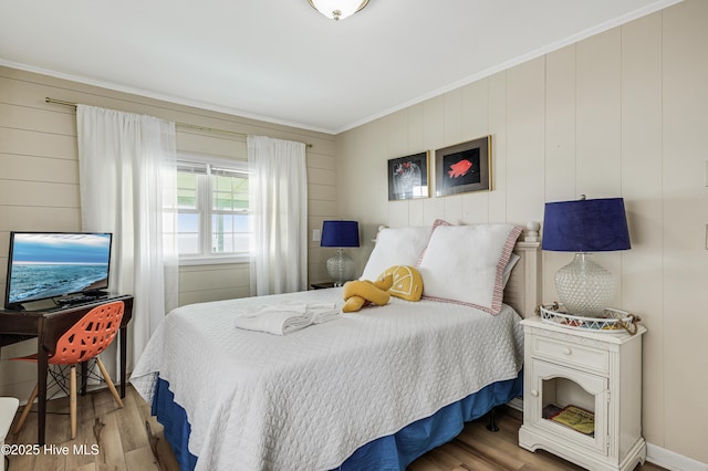 3325 W Beach Dr, Oak Island, NC 28465 - bedroom with wood finished floors and ornamental molding