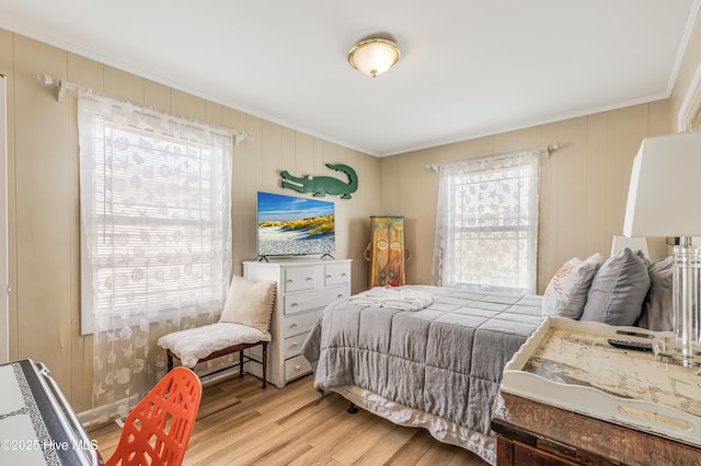 3325 W Beach Dr, Oak Island, NC 28465 - bedroom featuring crown molding and wood finished floors