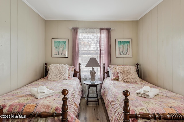 3325 W Beach Dr, Oak Island, NC 28465 - bedroom featuring wood finished floors and ornamental molding
