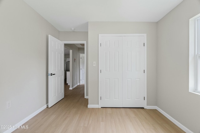 810 Morgan St, Elizabeth City, NC 27909 - unfurnished bedroom featuring baseboards and light wood-style floors
