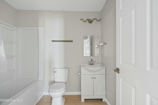 810 Morgan St, Elizabeth City, NC 27909 - bathroom featuring toilet, vanity, wood finished floors, baseboards, and tub / shower combination