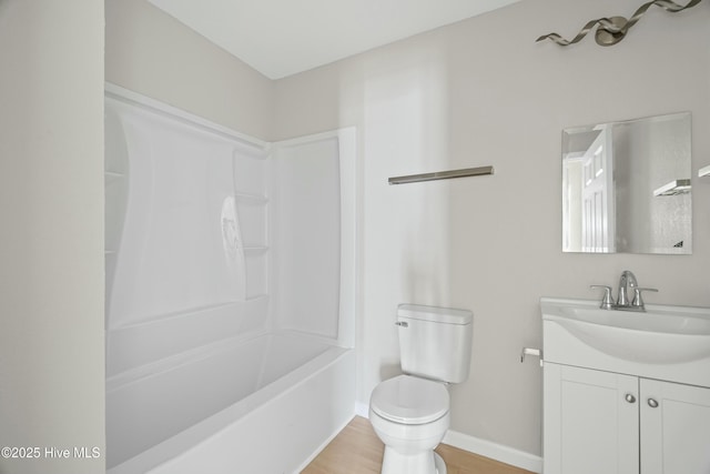 810 Morgan St, Elizabeth City, NC 27909 - bathroom featuring toilet, vanity, shower / washtub combination, wood finished floors, and baseboards