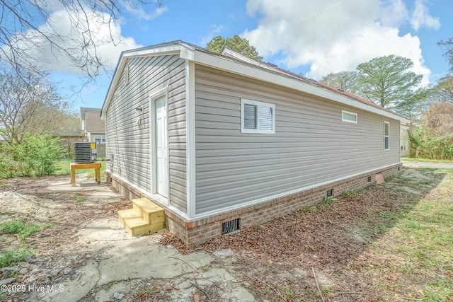810 Morgan St, Elizabeth City, NC 27909 - view of home's exterior with crawl space, entry steps, and central AC
