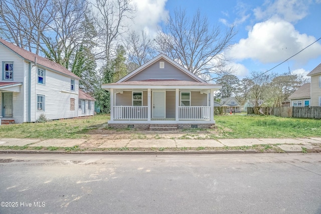 810 Morgan St, Elizabeth City, NC 27909 - bungalow-style house with a porch, crawl space, and fence