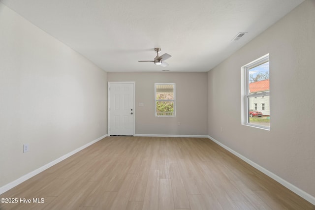 810 Morgan St, Elizabeth City, NC 27909 - unfurnished room featuring baseboards, light wood-style flooring, ceiling fan, and visible vents