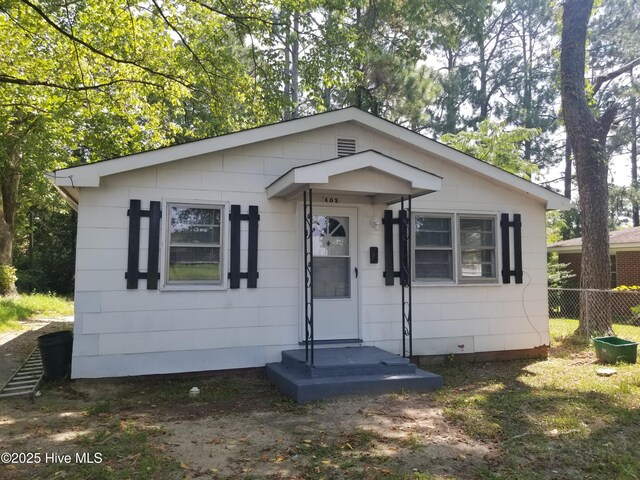 403 Jamesville Rd, Williamston, NC 27892 - bungalow-style house with fence