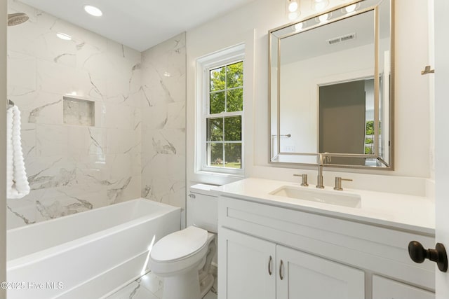 bathroom with vanity, toilet, visible vents, shower / bathing tub combination, and marble finish floor