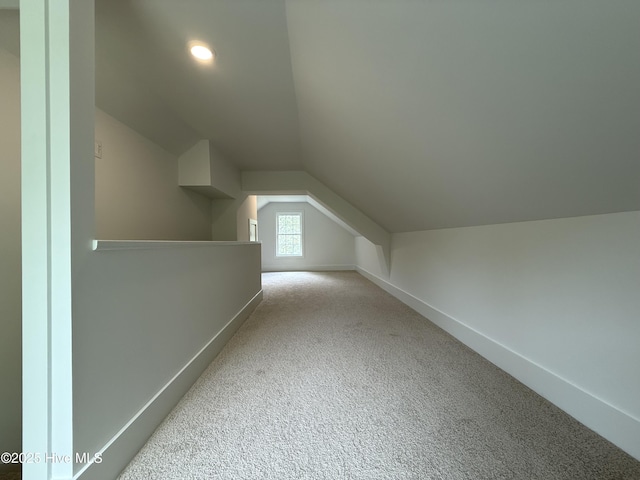 117 Victoria Dr, Wilmington, NC 28401 - additional living space with vaulted ceiling, baseboards, and carpet floors