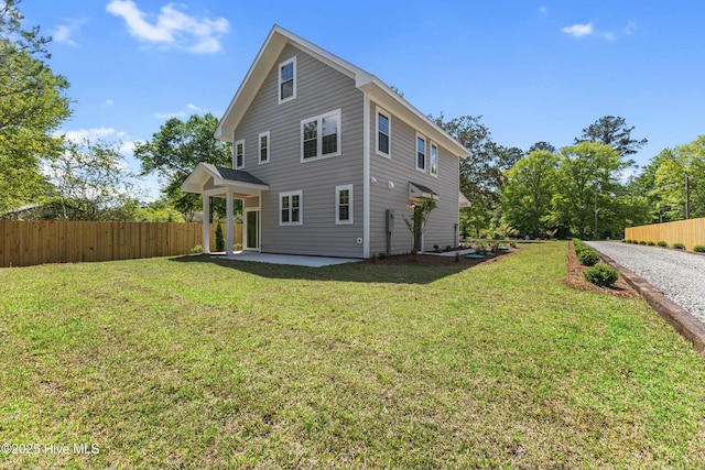 exterior space featuring a yard, fence, and a patio area