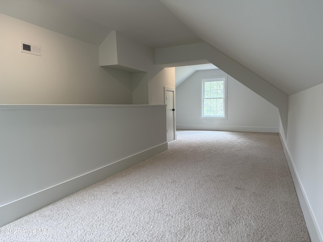 117 Victoria Dr, Wilmington, NC 28401 - additional living space featuring carpet flooring, vaulted ceiling, and baseboards