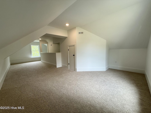 117 Victoria Dr, Wilmington, NC 28401 - additional living space featuring vaulted ceiling, baseboards, and carpet floors