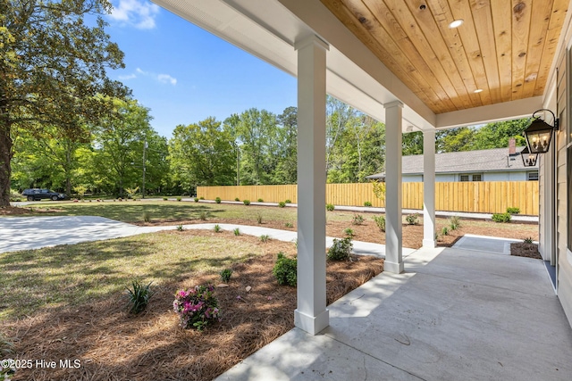 view of patio / terrace featuring fence