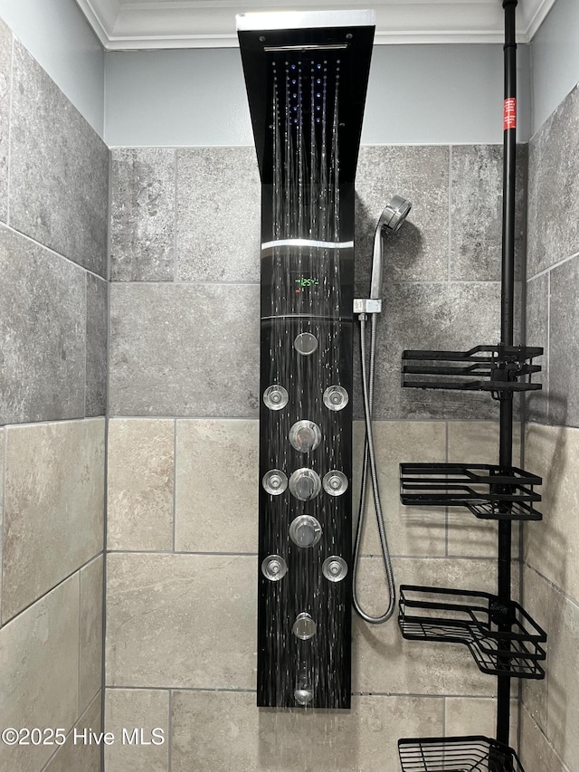 room details featuring ornamental molding and tiled shower