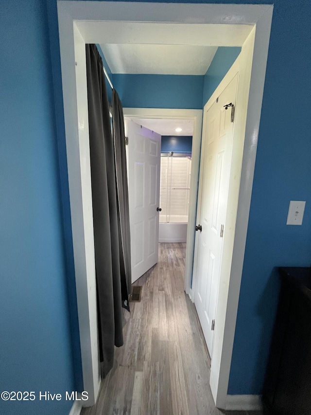 bedroom with baseboards, ceiling fan, and wood finished floors
