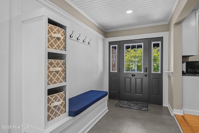 mudroom featuring tile patterned floors, baseboards, and ornamental molding