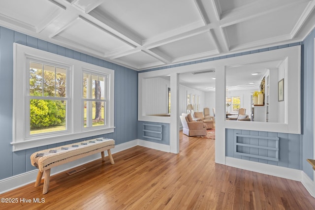 interior space with visible vents, beam ceiling, and coffered ceiling