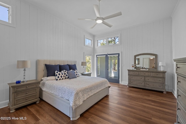bedroom with a ceiling fan, access to exterior, and dark wood-style floors