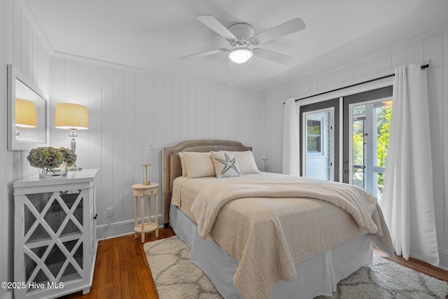 bedroom with wood finished floors, crown molding, ceiling fan, and access to outside