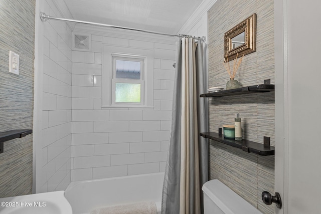 bathroom with crown molding, shower / tub combo with curtain, and toilet
