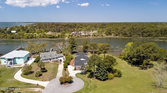 bird's eye view featuring a forest view and a water view