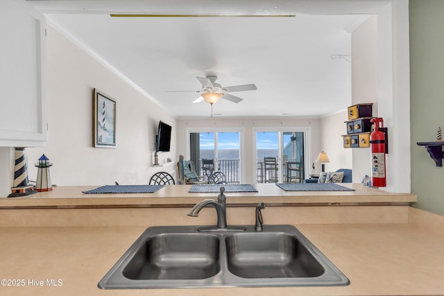 1437 Fort Fisher Blvd S Unit C2, Kure Beach, NC 28449 - kitchen featuring light countertops, a sink, crown molding, and ceiling fan