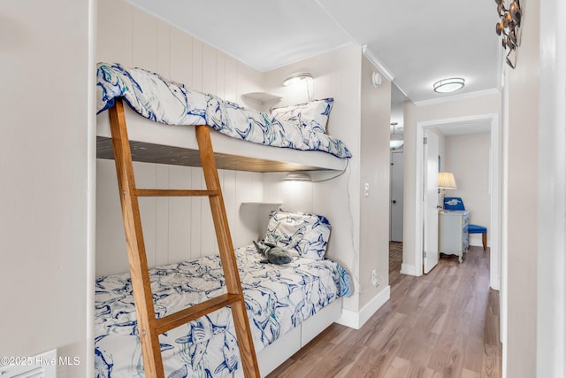 1437 Fort Fisher Blvd S Unit C2, Kure Beach, NC 28449 - bedroom with baseboards, ornamental molding, and wood finished floors