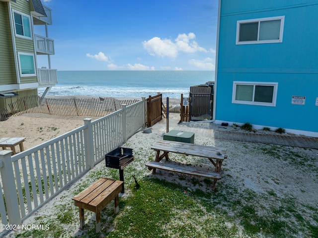 1437 Fort Fisher Blvd S Unit C2, Kure Beach, NC 28449 - view of community featuring a beach view, a water view, and fence