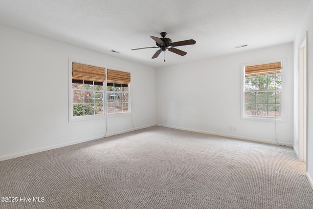 1710 Bay Tree Ct SW, Ocean Isle Beach, NC 28469 - spare room with baseboards, visible vents, ceiling fan, and carpet flooring