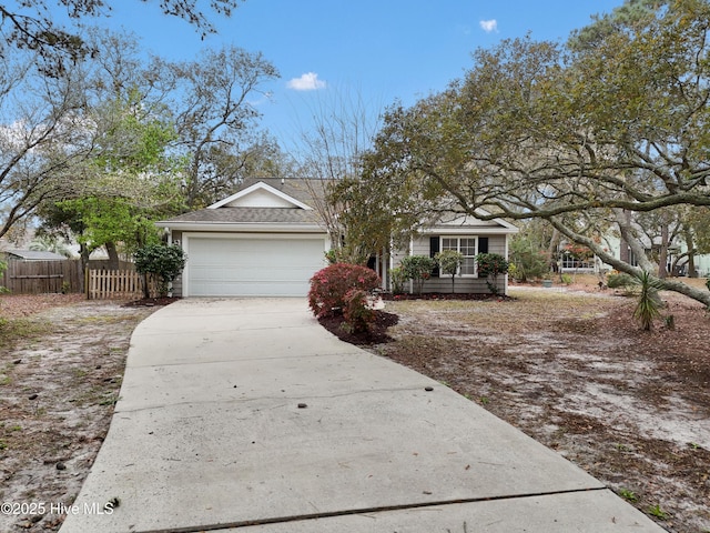 1710 Bay Tree Ct SW, Ocean Isle Beach, NC 28469 - view of front of property featuring driveway, fence, and an attached garage