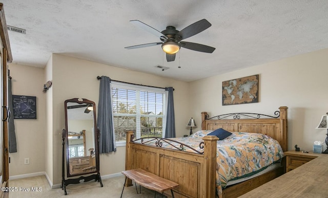 bedroom featuring light carpet, baseboards, a ceiling fan, and visible vents