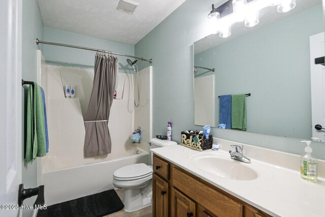bathroom with shower / bath combination with curtain, vanity, tile patterned flooring, visible vents, and toilet