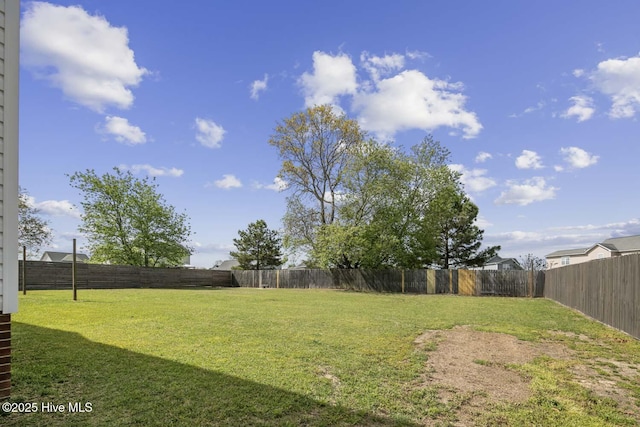 view of yard with a fenced backyard