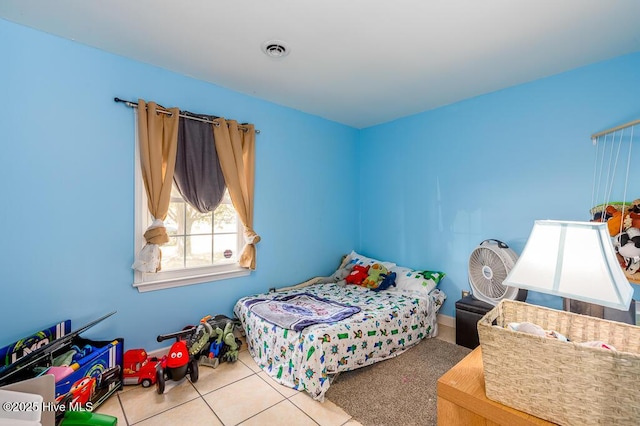 tiled bedroom featuring visible vents