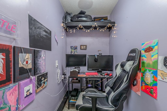 carpeted office space featuring a textured ceiling