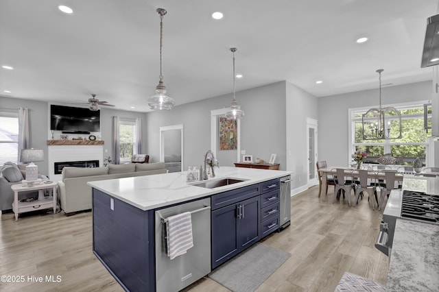 732 Avila Ave, Hampstead, NC 28443 - kitchen with a sink, blue cabinets, stainless steel dishwasher, healthy amount of natural light, and recessed lighting