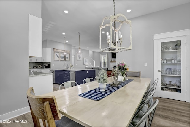 732 Avila Ave, Hampstead, NC 28443 - dining room featuring wood finished floors, a chandelier, and recessed lighting