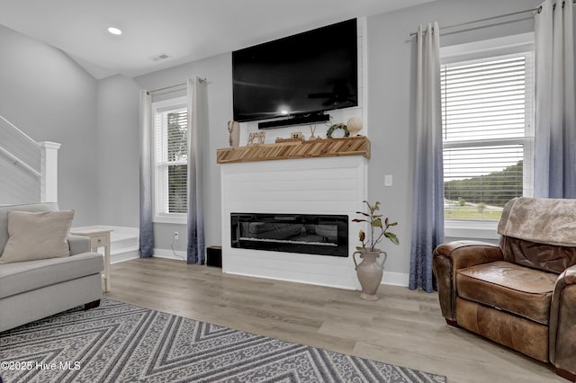 732 Avila Ave, Hampstead, NC 28443 - living room featuring light wood finished floors, a fireplace, baseboards, and recessed lighting