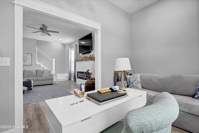 732 Avila Ave, Hampstead, NC 28443 - living area with wood finished floors, stairs, and a ceiling fan