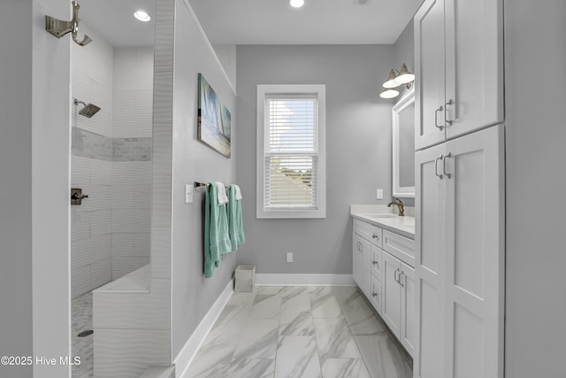 732 Avila Ave, Hampstead, NC 28443 - full bath with marble look tile flooring, a walk in shower, vanity, baseboards, and recessed lighting