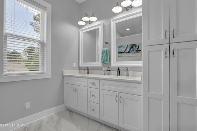 732 Avila Ave, Hampstead, NC 28443 - full bath featuring baseboards, double vanity, and marble look tile flooring