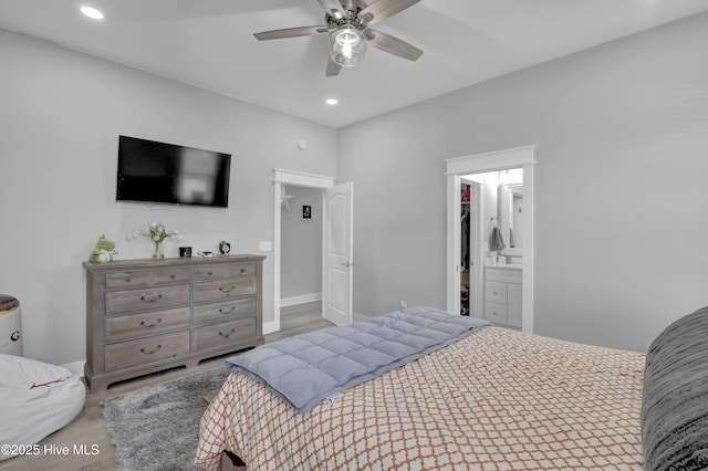 732 Avila Ave, Hampstead, NC 28443 - bedroom with wood finished floors, recessed lighting, a ceiling fan, baseboards, and ensuite bath