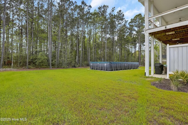 732 Avila Ave, Hampstead, NC 28443 - view of green lawn with an outdoor pool