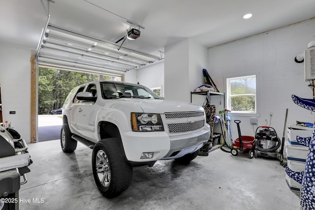 732 Avila Ave, Hampstead, NC 28443 - garage featuring a garage door opener and concrete block wall