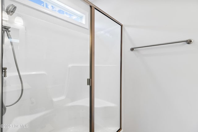 full bathroom with a shower stall