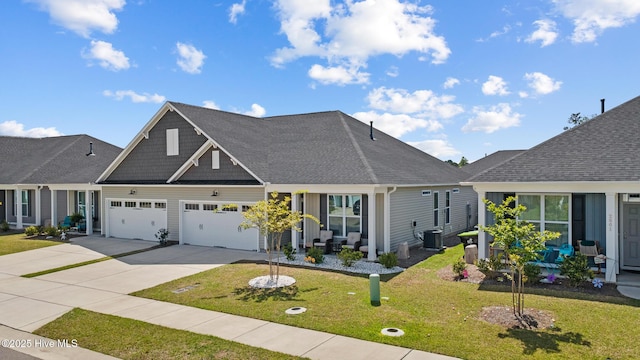 view of front of house featuring central AC, roof with shingles, a front lawn, a garage, and concrete driveway