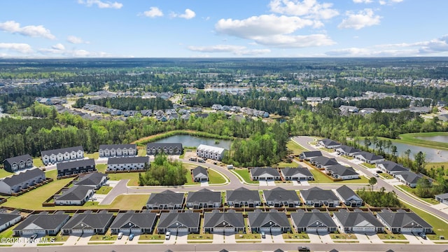 birds eye view of property featuring a water view and a residential view