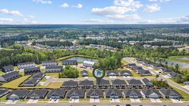 birds eye view of property with a water view and a residential view