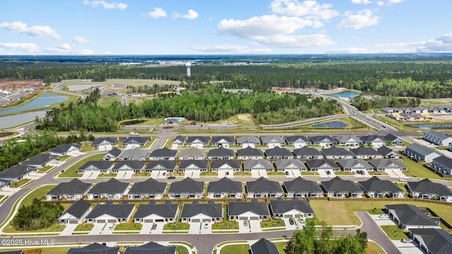 aerial view with a water view and a residential view